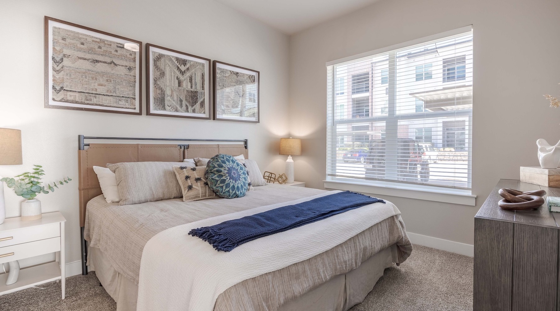 a bedroom with a bed and two nightstands